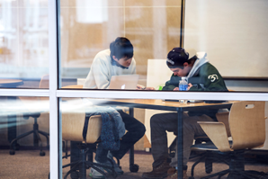 Two people working at a table