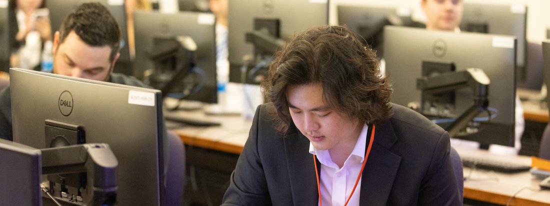 A person on a computer in a Whitman classroom.