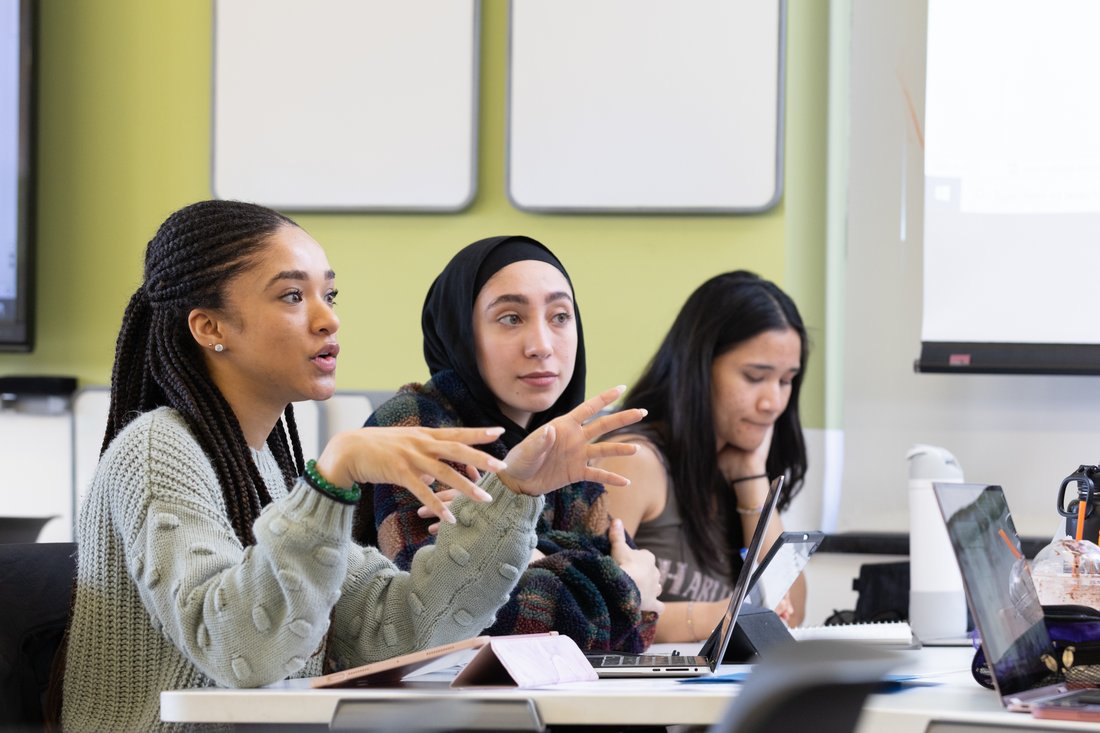 Three students during a lecture in a civil and environmental engineering classroom