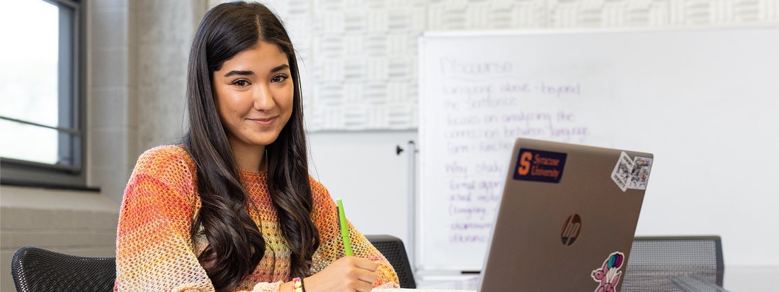 Communication and rhetorical studies major works on a writing assignment.