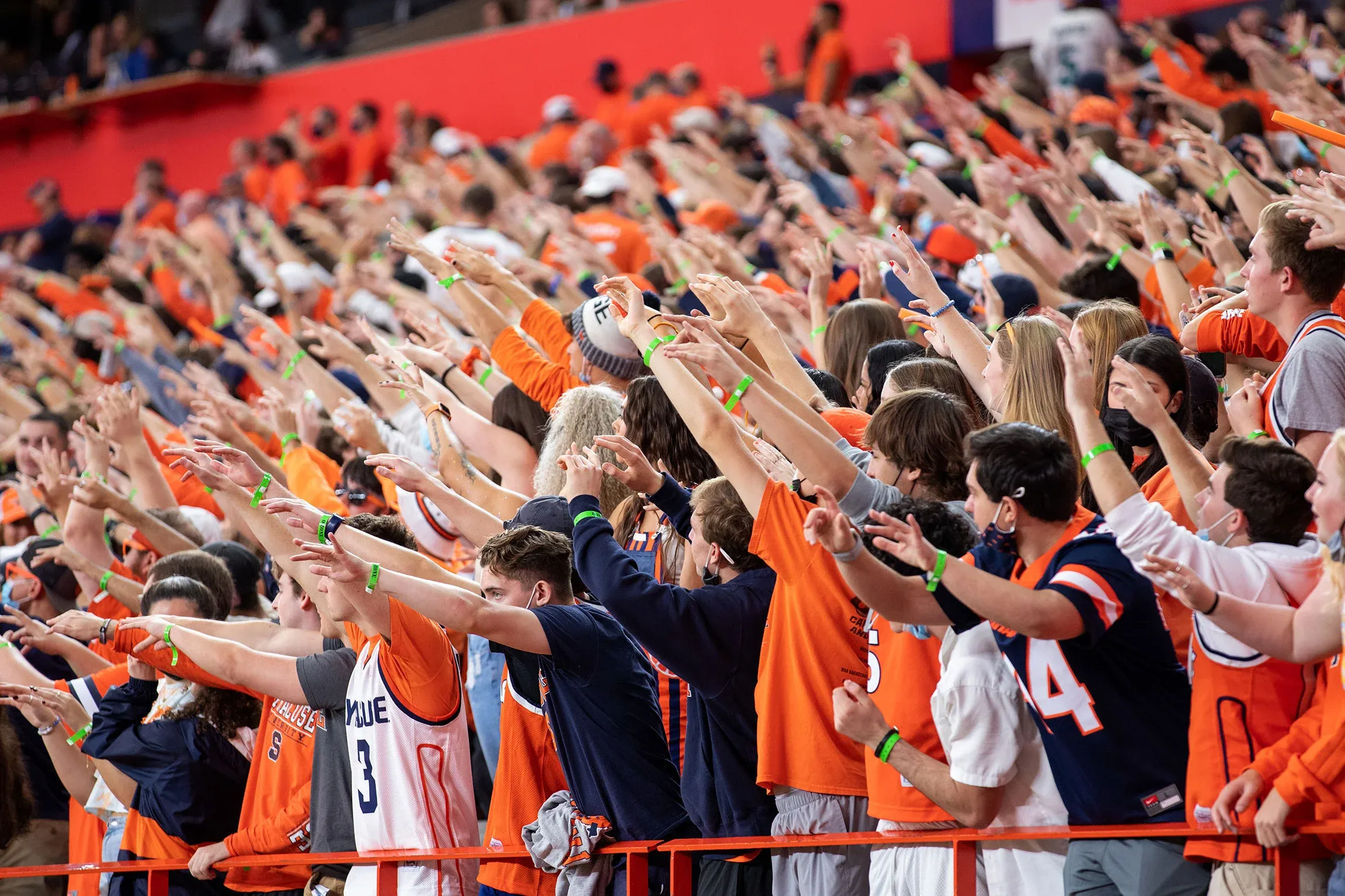 Students in the Dome cheering at a game.